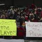 Portland Thorns fans hold signs during the first half of the team&#39;s NWSL soccer match against the Houston Dash in Portland, Ore., Wednesday, Oct. 6, 2021. An independent investigation into the scandals that erupted in the National Women&#39;s Soccer League last season found emotional abuse and sexual misconduct were systemic in the sport, impacting multiple teams, coaches and players, according to a report released Monday, Oct. 3, 2022. (AP Photo/Steve Dipaola, File) **FILE**