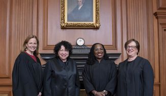 In this image provided by the Supreme Court, from left, Associate Justice Amy Coney Barrett, Associate Justice Sonia Sotomayor, Associate Justice Ketanji Brown Jackson, and Associate Justice Elena Kagan in the Justices’ Conference Room prior to the formal investiture ceremony for Jackson at the Supreme Court in Washington, Friday, Sept. 30, 2022.   (Fred Schilling/U.S. Supreme Court via AP)