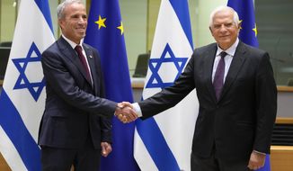 European Union foreign policy chief Josep Borrell, right, greets Israel&#39;s Minister of Intelligence Elazar Stern prior to a meeting of the EU-Israel Association Council at the EU Council building in Brussels on Monday, Oct. 3, 2022. (AP Photo/Virginia Mayo)