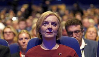 British Prime Minister Liz Truss at the Conservative Party annual conference at the International Convention Centre in Birmingham, England, Sunday Oct. 2, 2022. (Stefan Rousseau/PA via AP)