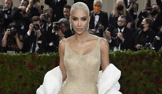 Kim Kardashian attends The Metropolitan Museum of Art&#39;s Costume Institute benefit gala celebrating the opening of the &amp;quot;In America: An Anthology of Fashion&amp;quot; exhibition on Monday, May 2, 2022, in New York. Kardashian has agreed to settle charges brought by the Securities and Exchange Commission and pay $1.26 million because she promoted on social media a crypto asset security offered and sold by EthereumMax without disclosing the payment she received for the plug. The SEC said Monday, Oct. 3, 2022, that Kardashian has agreed to cooperate with its ongoing investigation.(Photo by Evan Agostini/Invision/AP, File)