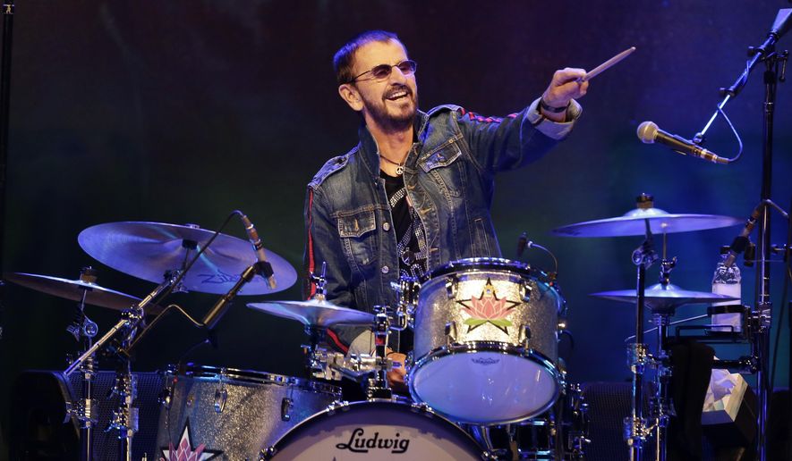 Ringo Starr plays as part of a concert celebrating the 50th anniversary of Woodstock in Bethel, N.Y., Friday, Aug. 16, 2019. Starr has tested positive for COVID-19, forcing the former Beatle to cancel several upcoming concerts in Canada with his All Starr Band. (AP Photo/Seth Wenig, File)