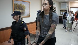 WNBA star and two-time Olympic gold medalist Brittney Griner is escorted from a court room after her last words, in Khimki just outside Moscow, Russia, on Aug. 4, 2022. The Moscow region&#39;s court on Monday Oct. 3, 2022 set a date for American basketball star Brittney Griner&#39;s appeal against her nine-year prison sentence for drug possession, scheduling the hearing for Oct. 25. (AP Photo/Alexander Zemlianichenko, File)