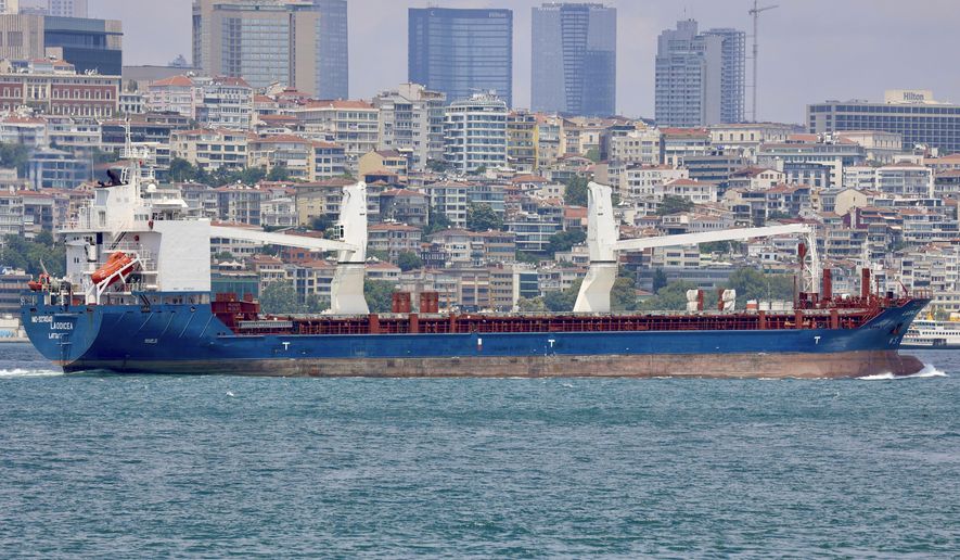 The cargo ship Laodicea sails through the Bosphorus Strait in Istanbul, Turkey, on July 7, 2022. An Associated Press investigation shows the ship, owned by the Syrian government, is part of an extensive Russian-run smuggling operation that has been hauling stolen Ukrainian grain from ports in occupied Crimea to customers in the Middle East. (AP Photo/Yoruk Isik)