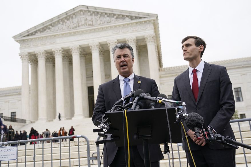 Alabama Attorney General Steve Marshall, left, speaks alongside Alabama Solicitor General Edmund LaCour following oral arguments in Merrill v. Milligan, an Alabama redistricting case that could have far-reaching effects on minority voting power across the United States, outside the Supreme Court on Capitol Hill in Washington, Tuesday, Oct. 4, 2022. (AP Photo/Patrick Semansky)