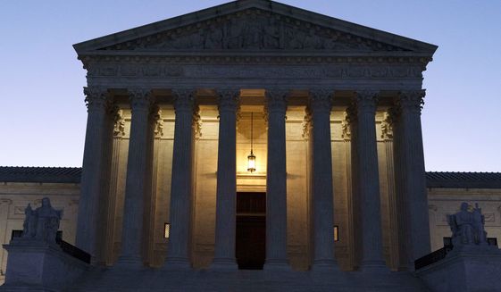 The U.S. Supreme Court is seen before sunrise on Capitol Hill in Washington, March 21, 2022. Lawyers for former President Donald Trump asked the U.S. Supreme Court on Tuesday, Oct. 4, to step into the legal fight over the classified documents seized during an FBI search of his Florida estate. (AP Photo/Jose Luis Magana, File)