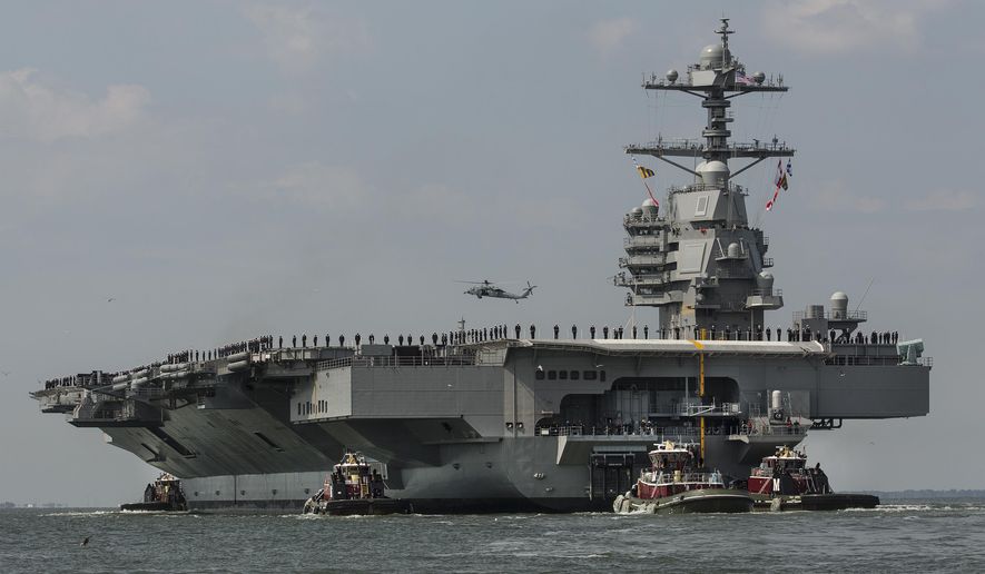In this April 14, 2017, file photo, as crew members stand on the deck, the aircraft carrier USS Gerald R. Ford heads to the Norfolk, Va., naval station. The U.S. Navy’s most advanced aircraft carrier embarked on its first-ever deployment Tuesday, Oct. 4, 2022, and will train with other NATO countries at a time of increasing Russian aggression in Ukraine. The USS Gerald R. Ford left the world’s largest Navy base in Norfolk, Virginia, along with destroyers and other ships that make up its carrier strike group. (Bill Tiernan/The Virginian-Pilot via AP, File)