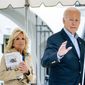 President Joe Biden and first lady Jill Biden walk out of the White House to board Marine One in Washington, Monday, Oct. 3, 2022, for a short trip to Andrews Air Force Base, Md., and then on to Puerto Rico. (AP Photo/Andrew Harnik)