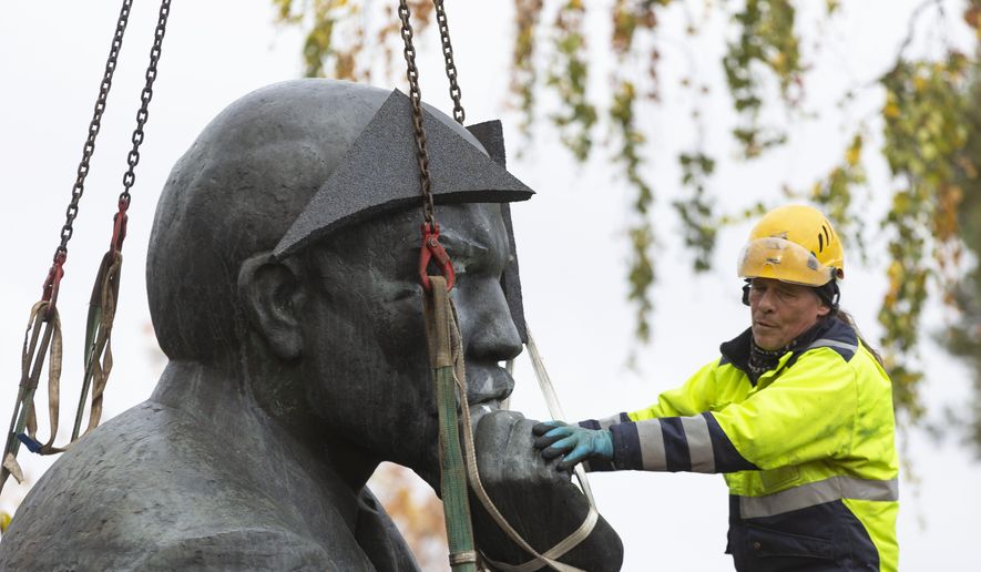 A statue of Vladimir Lenin is removed from the streets of the city of Kotka, Finland Tuesday, Oct. 4, 2022. The southeastern Finnish city of Kotka on Tuesday removed the last publicly displayed statue of Russian bolshevik leader Vladimir Lenin in the Nordic country due to increasing pressure from residents in the wake of Russia’s war in Ukraine. (Sasu Makinen/Lehtikuva via AP)