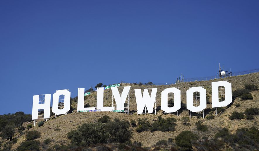 The Hollywood sign is pictured on Sept. 29, 2022, in Los Angeles. The Hollywood sign is getting a makeover befitting its status as a Tinseltown icon. After a pressure wash and some rust removal, workers this week began using 250 gallons of primer and white paint to spruce up the sign ahead of its centennial next year. (AP Photo/Chris Pizzello, File)