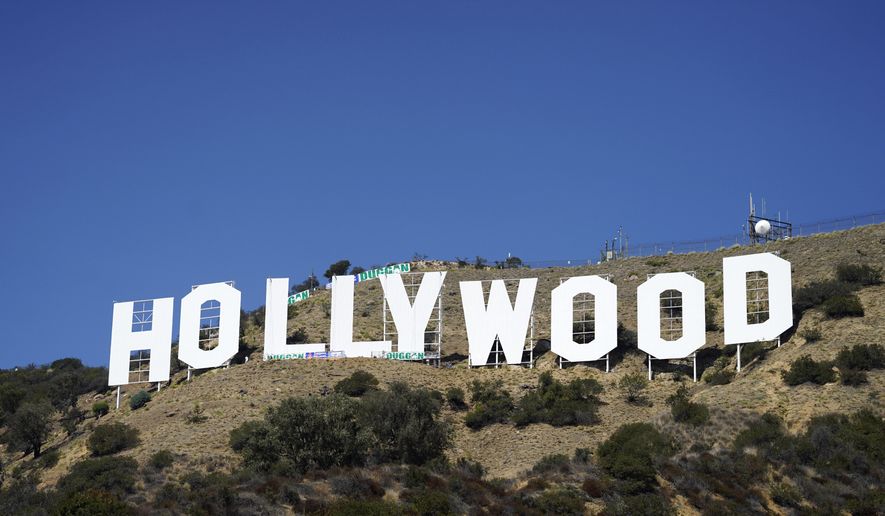 The Hollywood sign is pictured on Sept. 29, 2022, in Los Angeles. The Hollywood sign is getting a makeover befitting its status as a Tinseltown icon. After a pressure wash and some rust removal, workers this week began using 250 gallons of primer and white paint to spruce up the sign ahead of its centennial next year. (AP Photo/Chris Pizzello, File)