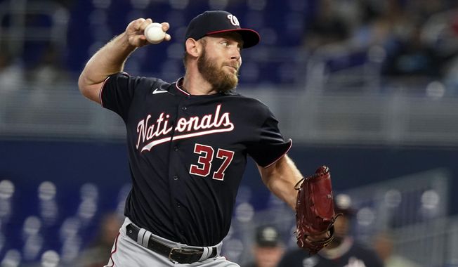 Washington Nationals starting pitcher Stephen Strasburg throws during the first inning of a baseball game against the Miami Marlins, on June 9, 2022, in Miami.  Nationals general manager Mike Rizzo says Strasburg’s status for 2023 is up in the air after a series of injuries limited the pitcher to one start this season. (AP Photo/Marta Lavandier, File) **FILE**