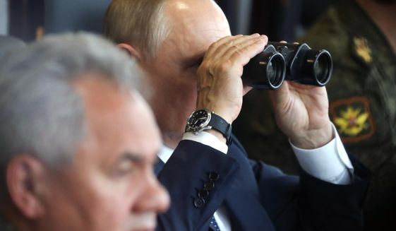 Russian President Vladimir Putin, center, watches through binoculars as Russian Defense Minister Sergei Shoigu sits near during the joint strategic exercise of the armed forces of the Russian Federation and the Republic of Belarus Zapad-2021 at the Mulino training ground in the Nizhny Novgorod region, Russia, on Sept. 13, 2021. Putin&#39;s threats to use &amp;quot;all the means at our disposal&amp;quot; to defend his country as it wages war in Ukraine have cranked up global fears that he might use his nuclear arsenal, with the world&#39;s largest stockpile of warheads. (Sergei Savostyanov, Sputnik, Kremlin Pool Photo via AP, File)