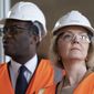 Britain&#39;s Prime Minister Liz Truss, foreground and Chancellor of the Exchequer Kwasi Kwarteng look on, during a visit to a construction site for a medical innovation campus, on day three of the Conservative Party annual conference at the International Convention Centre in Birmingham, England, Tuesday, Oct. 4, 2022. (Stefan Rousseau/Pool Photo via AP)