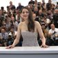 Marion Cotillard poses for photographers at the photo call for the film &quot;Brother and Sister&quot; at the 75th international film festival, Cannes, southern France, Saturday, May 21, 2022. Oscar-winning actresses Marion Cotillard and Juliette Binoche, as well as other French stars of screen and music, filmed themselves chopping off locks of their hair in a video posted Wednesday, Oct. 5, 2022, in support of protesters in Iran. (AP Photo/Petros Giannakouris, File)