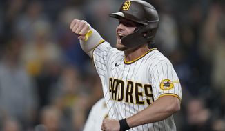 San Diego Padres&#x27; Wil Myers celebrates after hitting a home run during the eighth inning of a baseball game against the San Francisco Giants, Tuesday, Oct. 4, 2022, in San Diego. (AP Photo/Gregory Bull)