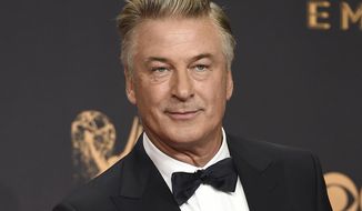 Alec Baldwin poses in the press room with the award for outstanding supporting actor in a comedy series for &amp;quot;Saturday Night Live&amp;quot; at the 69th Primetime Emmy Awards in Los Angeles on Sept. 17, 2017. The family of a cinematographer shot and killed by Alec Baldwin on the set of the film “Rust” has agreed to settle a lawsuit against Baldwin and the movie&#x27;s producers, and production will resume on the project. (Photo by Jordan Strauss/Invision/AP, File)