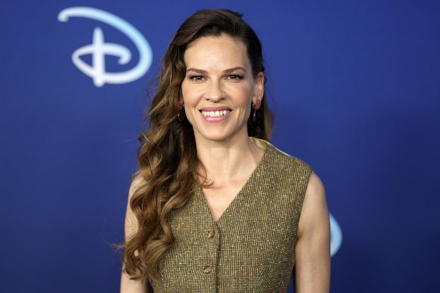 Hilary Swank attends the Disney 2022 Upfront presentation at Basketball City Pier 36 on May 17, 2022, in New York. Swank announced, Wednesday, Oct. 5, 2022, the she's pregnant with twins and says that revelation might explain some of her wardrobe alterations and other actions on set of her new ABC series “Alaska Daily.” (Photo by Charles Sykes/Invision/AP, File)