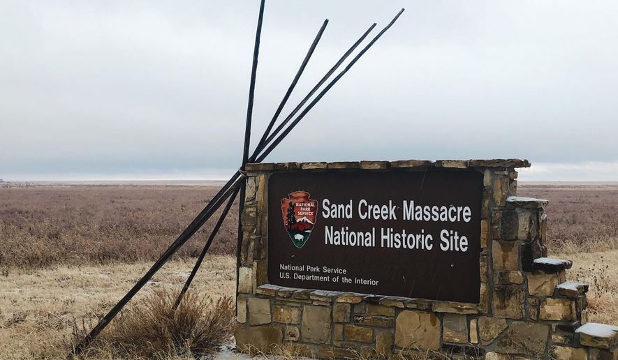 An entrance sign is shown at the Sand Creek Massacre National Historic Site in Eads, Colo., on Dec. 27, 2019. This quiet piece of land tucked away in rural southeastern Colorado seeks to honor the 230 peaceful Cheyenne and Arapaho tribe members who were slaughtered by the U.S. Army in 1864. It was one of worst mass murders in U.S. history. (AP Photo/Russell Contreras, File)