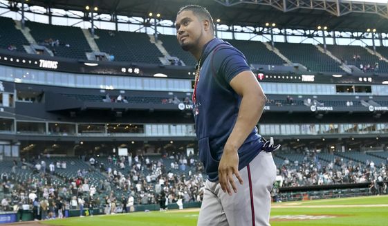 Minnesota Twins&#39; Luis Arraez smiles at fans after the team&#39;s 10-1 win over the Chicago White Sox in a baseball game Wednesday, Oct. 5, 2022, in Chicago. (AP Photo/Nam Y. Huh)