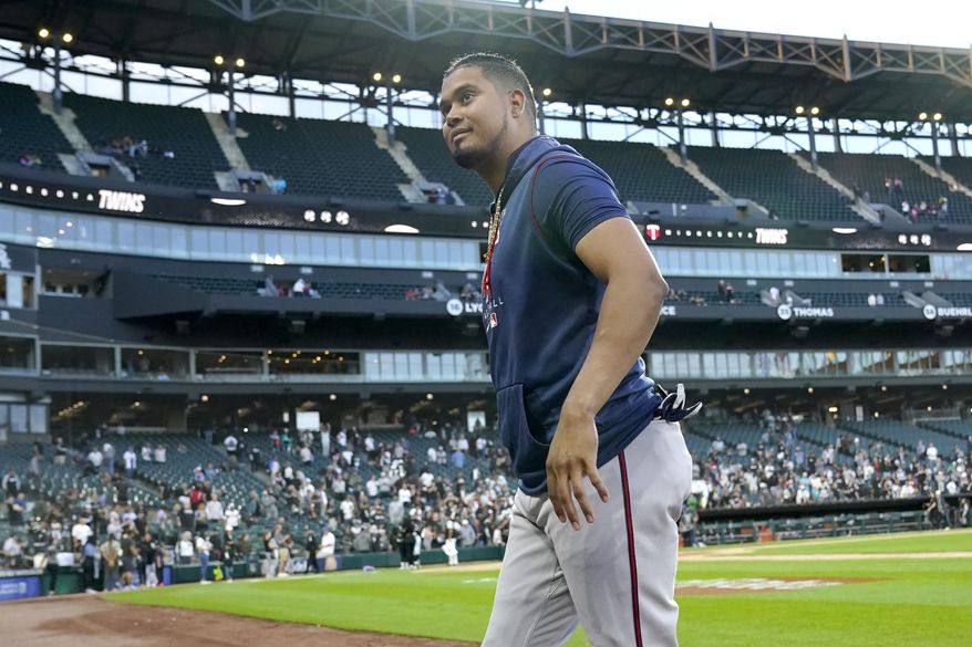 Minnesota Twins&#39; Luis Arraez smiles at fans after the team&#39;s 10-1 win over the Chicago White Sox in a baseball game Wednesday, Oct. 5, 2022, in Chicago. (AP Photo/Nam Y. Huh)