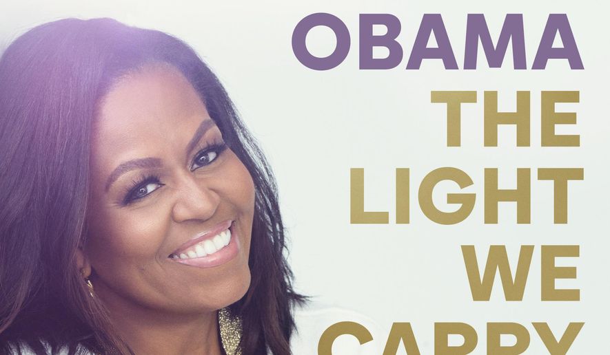 This cover image released by Crown/Penguin Random House shows &quot;The Light We Carry&quot; by Michelle Obama. The former first lady will embark oa multi-city tour this fall in support of her new book, “The Light We Carry: Overcoming in Uncertain Times,” beginning mid-November in Washington. D.C. and ending a month later in Los Angeles.  (Crown/PRH via AP)