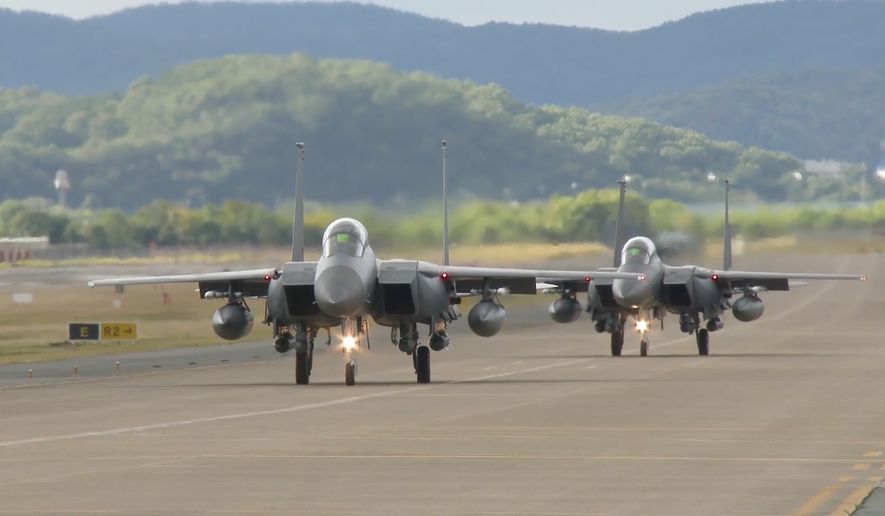 In this image taken from video, South Korean Air Force&#x27;s F15K fighter jets prepare to take off Tuesday, Oct. 4, 2022, in an undisclosed location in South Korea. South Korea says North Korea flew 12 warplanes near their mutual border on Thursday, Oct. 6, 2022, prompting South Korea to scramble 30 military planes in response. (South Korean Defense Ministry via AP)