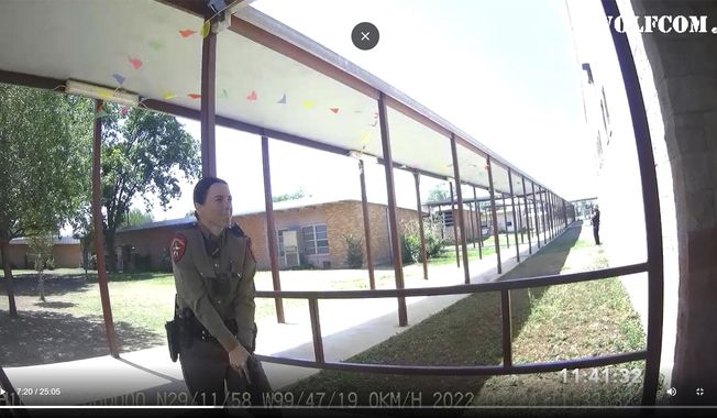 This image from video released by the City of Uvalde, Texas shows Texas Department of Public Safety trooper Crimson Elizondo responding to a shooting at Robb Elementary School, on May 24, 2022 in Uvalde, Texas.  The former Texas state trooper under investigation for the law enforcement response to the deadly school shooting in Uvalde has been hired by the school district as a campus police officer. (City of Uvalde via AP)