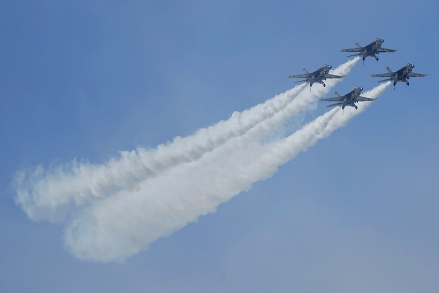 U.S. Navy Blue Angels fly over the bay during the San Francisco Fleet Week Air Show in San Francisco, Friday, Oct. 7, 2022. (AP Photo/Jeff Chiu)