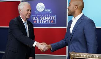 U.S. Sen. Ron Johnson, R-Wis., left, and his Democratic challenger Mandela Barnes shake hands before a televised debate, Friday, Oct. 7, 2022, in Milwaukee. (AP Photo/Morry Gash)