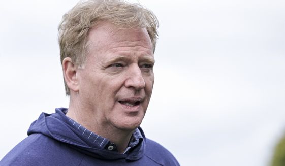 The NFL Commissioner Roger Goodell watching local school children during a Flag Football school event after Green Bay Packers practice at the Grove Hotel, Watford, north of London on Friday, Oct. 07 2022 in London. (AP Photo/Anthony Upton)