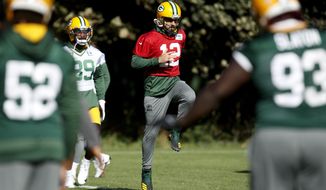 Green Bay Packers quarterback Aaron Rodgers trains at The Grove in Chandler&#39;s Cross, England, Friday, Oct. 7, 2022 ahead the NFL game against New York Giants at the Tottenham Hotspur stadium on Sunday. (AP Photo/David Cliff)