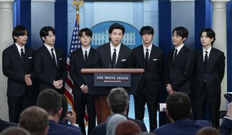 RM, center, accompanied by other K-pop supergroup BTS members from left, V, Jungkook, Jimin, Jin, J-Hope, and Suga speaks during the daily briefing at the White House in Washington, Tuesday, May 31, 2022. South Korea’s military appears to want to draft members of the K-pop supergroup BTS for mandatory military duties, as the public is sharply divided over whether they must be exempted from the service. (AP Photo/Evan Vucci, File)