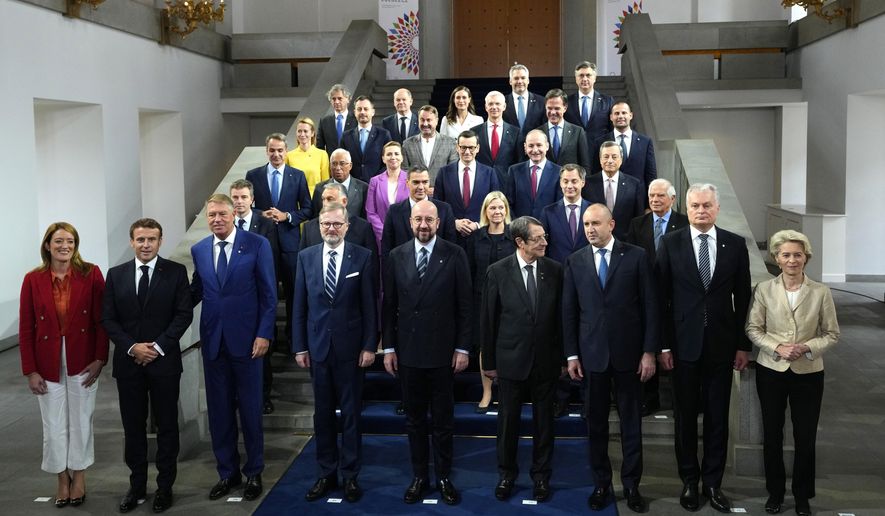 European Union leaders pose for a group photo during an EU Summit at Prague Castle in Prague, Czech Republic, Friday, Oct 7, 2022. European Union leaders converged on Prague Castle Friday to try to bridge significant differences over a natural gas price cap as winter approaches and Russia&#x27;s war on Ukraine fuels a major energy crisis. Front row left, to right, European Parliament President Roberta Metsola, French President Emmanuel Macron, Romania&#x27;s President Klaus Werner Ioannis, Czech Republic&#x27;s Prime Minister Petr Fiala, European Council President Charles Michel, Cypriot President Nicos Anastasiades, Bulgaria&#x27;s President Rumen Radev, Lithuania&#x27;s President Gitanas Nauseda and European Commission President Ursula von der Leyen. (AP Photo/Petr David Josek)