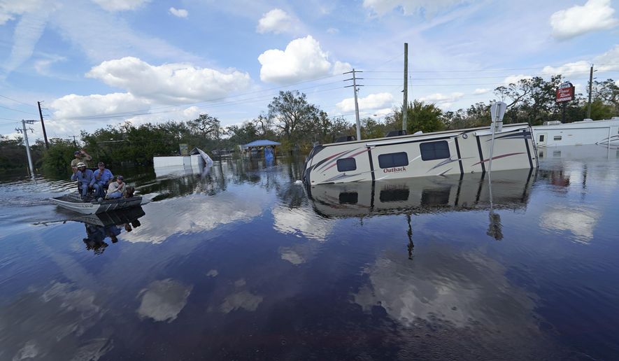 Flooded campers are seen at the Peace River Campground in the aftermath of Hurricane Ian in Arcadia, Fla., Monday, Oct. 3, 2022. (AP Photo/Gerald Herbert)
