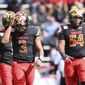 Maryland quarterback Taulia Tagovailoa, left, reacts after throwing an interception against Purdue in the first half of an NCAA college football game, Saturday, Oct. 8, 2022, in College Park, Md. (AP Photo/Gail Burton)