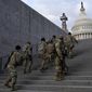 National Guard members take a staircase toward the U.S. Capitol building before a rehearsal for President-elect Joe Biden&#39;s Presidential Inauguration in Washington, Jan. 18, 2021. Soldiers are leaving the Army National Guard at a faster rate than they are enlisting, fueling concerns that in the coming years units around the country may not meet military requirements for overseas and other deployments. Officials say the number of soldiers retiring or leaving the Guard each month in the past year has exceeded those coming in, for a total annual loss of about 7,500 service members. (AP Photo/Patrick Semansky, File)