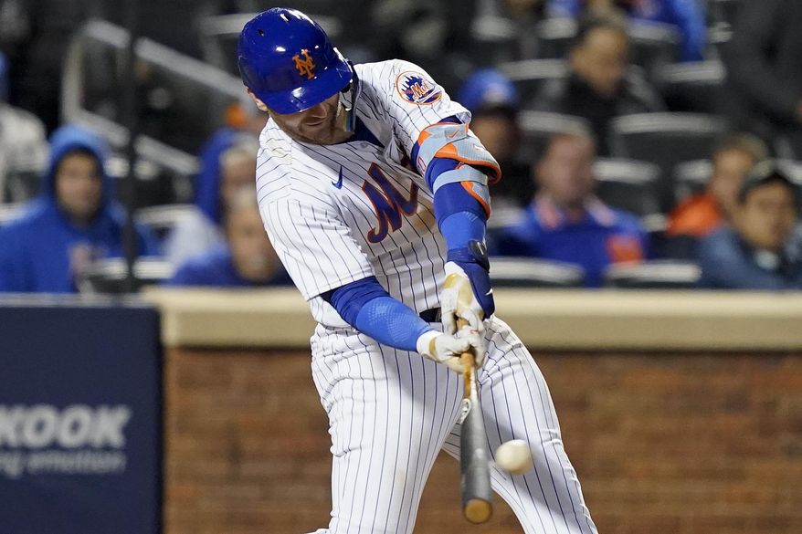 New York Mets Pete Alonso connects for a solo home run against the San Diego Padres during the fifth inning of Game 2 of a National League wild-card baseball playoff series, Saturday, Oct. 8, 2022, in New York. (AP Photo/John Minchillo)
