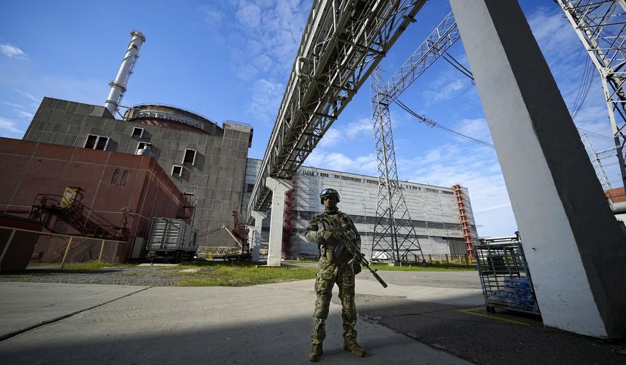 A Russian serviceman guards an area of the Zaporizhzhia Nuclear Power Station in territory under Russian military control, southeastern Ukraine, on May 1, 2022. Ukraine&#x27;s Zaporizhzhia nuclear power plant, the biggest in Europe, has lost its last remaining external power source due to renewed shelling and is now relying on emergency diesel generators, the U.N. nuclear watchdog said Saturday, Oct. 8, 2022. (AP Photo, File)
