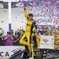 Christopher Bell celebrates in Victory Lane after winning a NASCAR Cup Series auto race at Charlotte Motor Speedway, Sunday, Oct. 9, 2022, in Concord, N.C. (AP Photo/Matt Kelley)