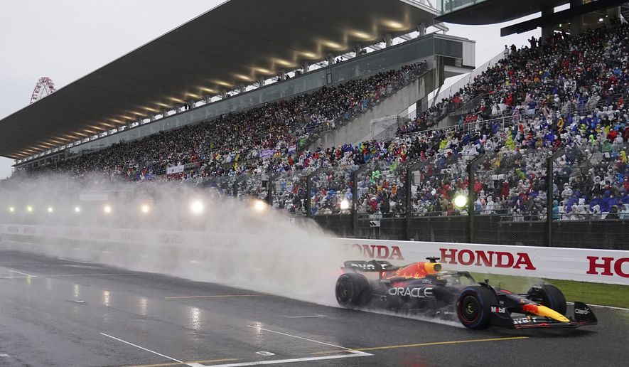 Red Bull driver Max Verstappen of the Netherlands powers his car during the Japanese Formula One Grand Prix at the Suzuka Circuit in Suzuka, central Japan, Sunday, Oct. 9, 2022. (AP Photo/Toru Hanai, Pool)