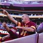 Washington Commanders fans react after their team was intercepted in the last seconds of an NFL football game against the Tennessee Titans on Sunday, Oct. 9, 2022, in Landover, Md. (Shaban Athuman/Richmond Times-Dispatch via AP) **FILE**