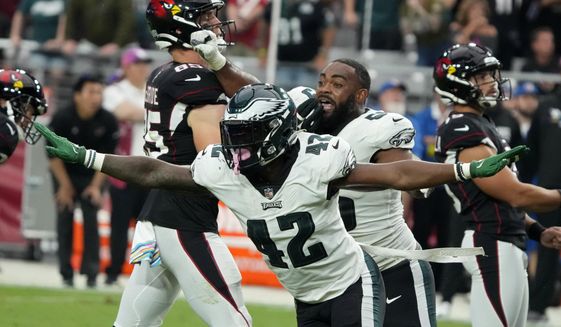 Philadelphia Eagles safety K&#39;Von Wallace (42) celebrates after the Arizona Cardinals missed a field goal attempt during the second half an NFL football game, Sunday, Oct. 9, 2022, in Glendale, Ariz. (AP Photo/Rick Scuteri)