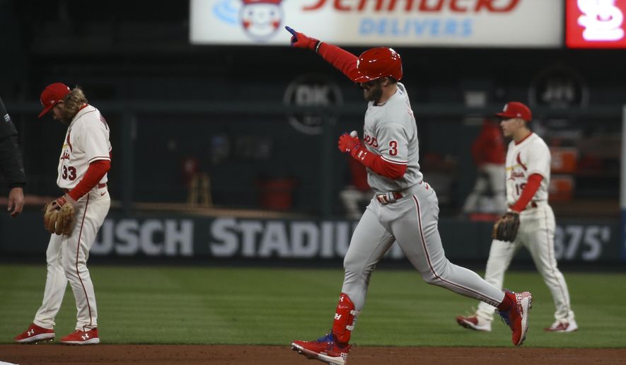 Philadelphia Phillies&#x27; Bryce Harper (3) reacts after hitting a solo home run during the second inning in Game 2 of a National League wild-card baseball playoff series against the St. Louis Cardinals, Saturday, Oct. 8, 2022, in St. Louis. (AP Photo/Scott Kane)