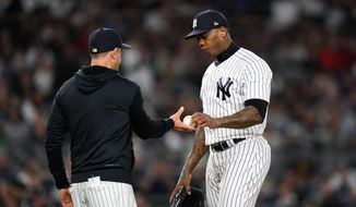 New York Yankees relief pitcher Aroldis Chapman hands the ball to manager Aaron Boone during the eighth inning of a baseball game against the Boston Red Sox Thursday, Sept. 22, 2022, in New York. (AP Photo/Frank Franklin II)  **FILE**