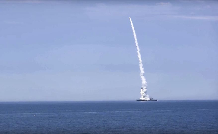 In this handout photo released by Russian Defense Ministry Press Service on Monday, Oct. 10, 2022, a Russian warship launches a cruise missile at a target in Ukraine. (Russian Defense Ministry Press Service via AP)