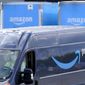 An Amazon Prime logo appears on the side of a delivery van as it departs an Amazon Warehouse location in Dedham, Mass., Oct. 1, 2020. Amazon said Monday, Oct. 10, 2022, that it will invest 1 billion euros ($972.1 million) to add thousands of more eclectic vans, long-haul trucks and cargo bikes to its delivery network in Europe. (AP Photo/Steven Senne, File)