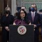 FILE - Los Angeles City Council President Nury Martinez at podium, and Mayor Eric Garcetti, standing to her right, are seen during a news conference at Los Angeles City Hall in Los Angeles on April 1, 2022. The president of the Los Angeles City Council resigned from the post Monday, Oct. 10, 2022, after she was heard making racist comments and other coarse remarks in a leaked recording of a conversation with other Latino leaders. Council President Nury Martinez issued an apology and expressed shame. (AP Photo/Damian Dovarganes, File)