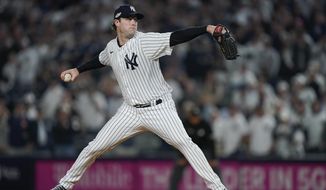 New York Yankees starting pitcher Gerrit Cole delivers against the Cleveland Guardians during the first inning of Game 1 of an American League Division baseball series, Tuesday, Oct. 11, 2022, in New York. (AP Photo/John Minchillo)