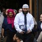 Adnan Syed, center right, leaves the courthouse after a hearing on Sept. 19, 2022, in Baltimore. Hae Min Lee&#39;s brother, Young Lee, has asked the Maryland Court of Special Appeals to halt court proceedings for Syed, whose conviction in Lee&#39;s 1999 killing was reversed by Baltimore Circuit Judge Melissa Phinn in September 2022. Now, the office of Maryland&#39;s attorney general is supporting the brother&#39;s appeal. (Jerry Jackson/The Baltimore Sun via AP) **FILE**